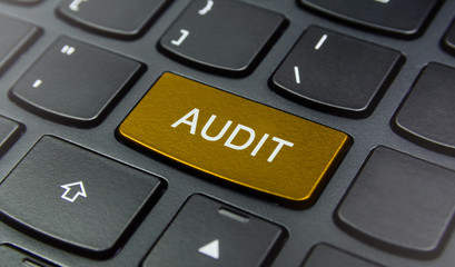 Close-up the Audit button on the keyboard and have Yellow color button isolate black keyboard
