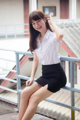 Obraz premium Portrait of thai adult student university uniform beautiful girl relax and smile