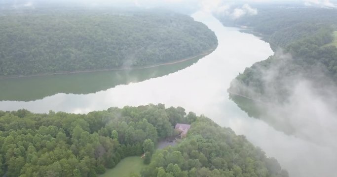 Fly over River Trees and home pan down