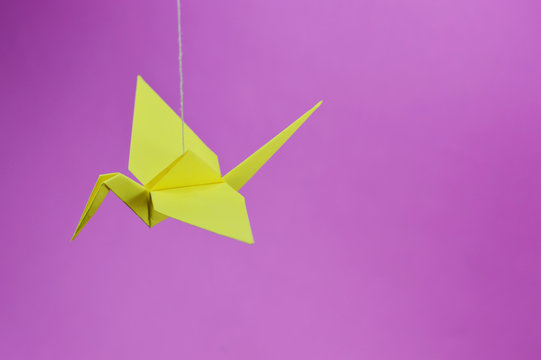 yellow origami crane top view