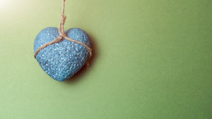 Blue heart in a rope loop concept of nonviolence