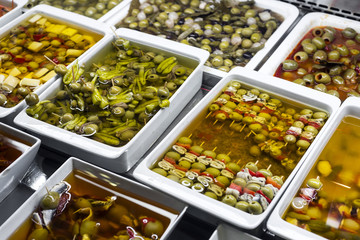 mixed olive snacks in market display trays barcelona spain