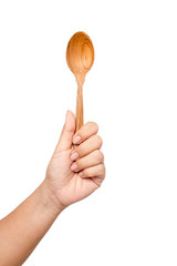 wooden spoon in woman hand isolated on white background