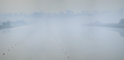 Fototapeta na wymiar Fog on the rowing channel. Rostov-on-Don. Russia