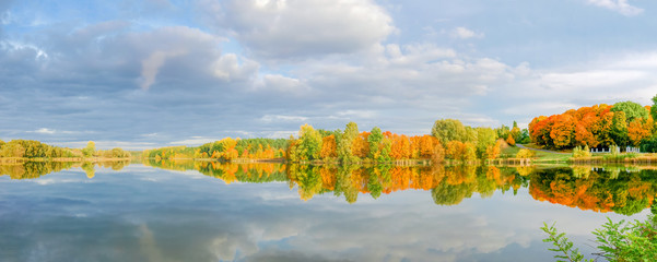 Autumn forest and park on the shore of the lake