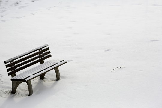 Seat covered in snow in my back garden in Bavaria, Germany © griangraf