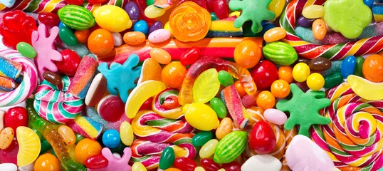 Foto auf Acrylglas Süßigkeiten Verschiedene bunte Bonbons, Gelees, Lutscher und Marmelade