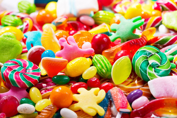 Various colorful candies, jellies, lollipops and marmalade