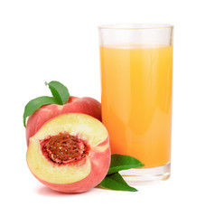 Glass of fruit juice and cut peaches isolated on white background