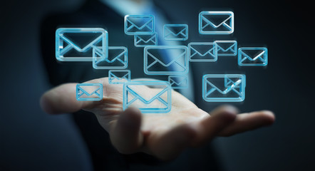 Businessman holding and touching floating emails 3D rendering