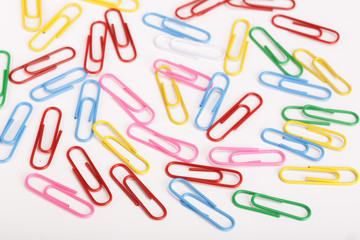 colorful paper clips isolated on white background