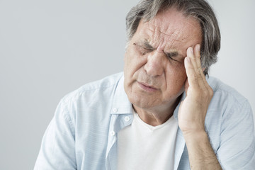 Senior man with headache