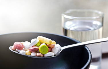 medicines full of spoon on bowl ceramic.