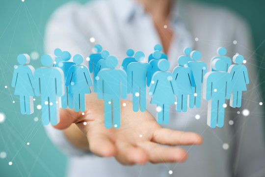 Businesswoman holding and touching 3D rendering group of blue people