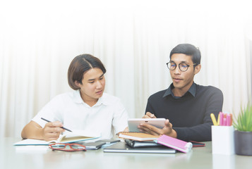 Teenage Boy Studying With Home Tutor.