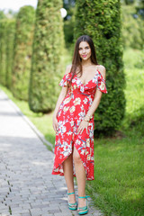 Fototapeta premium Outdoors portrait of beautiful brunette girl looking at camera
