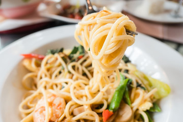 closeup Spaghetti with Cutlery on white plate . Italian food .