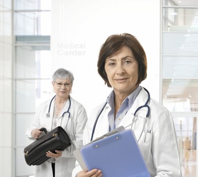 Portrait of mature female doctor at medical center