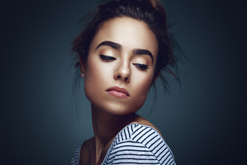 Beauty portrait of young woman in studio