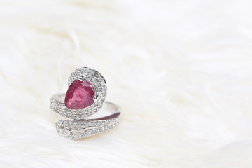 pink gemstone on diamond ring