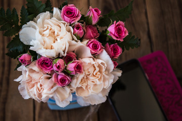 roses tea and bible on a wooden background