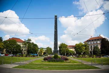 Fototapeta na wymiar Obelisk at the Karolinenplatz in Munich at sunshine