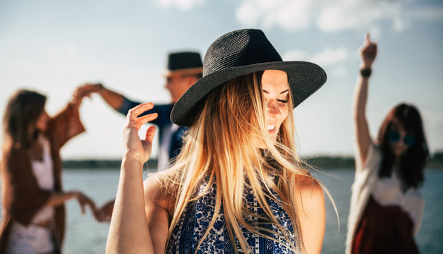 Group Of Friends Dancing And Celebrating On Beach, Boho Party