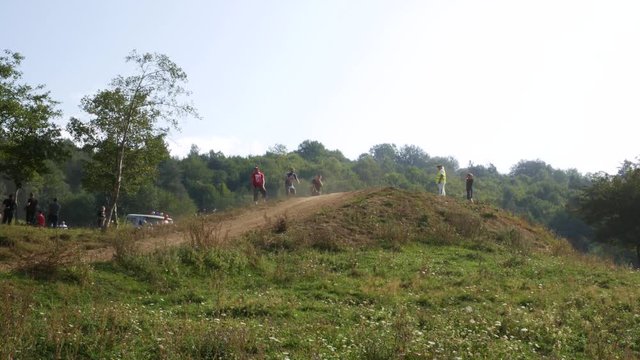 VELYKYI BEREZNYI, TRANSKARPATIA, UKRAINE - AUGUST 28, 2017: Motorcyclists go to the hill one by one. 