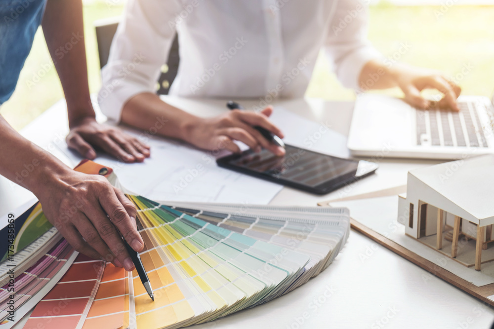 Leinwandbilder two interior design or graphic designer at work on project of architecture drawing with work tools a