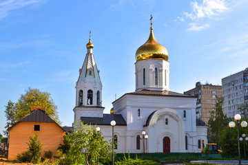Fototapeta na wymiar White orthodox church against the blue sky