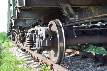 Fototapeta na wymiar Wheels of a freight railway car close-up. Russia