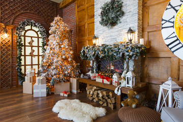 Cozy christmas interior with fir tree and fireplace