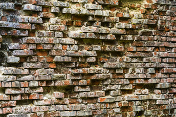 Texture of orange and beige brick wall.