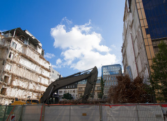 Excavator by former Bank building in the inner city of Duesseldorf, Germany, Europe
