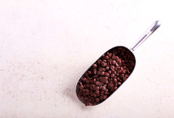 Chocolate chips in metal scoop