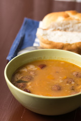 Selective focus on the homemade domestic cooked beans with sausages