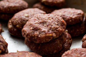 Raw Minced Meat Meatballs in a pan.