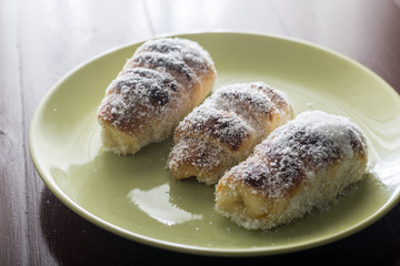 Homemade domestic rolls with coconut served on the plate
