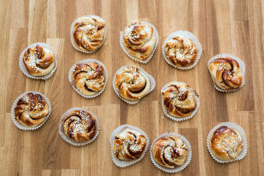 Cinnamon buns on wooden table