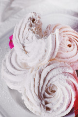 Sweets and desserts, soft, airy and sweet white marshmallows on a gentle light background