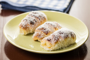 Homemade domestic rolls with coconut served on the plate