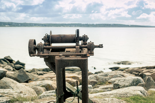 Blue sky rusty tool on shore
