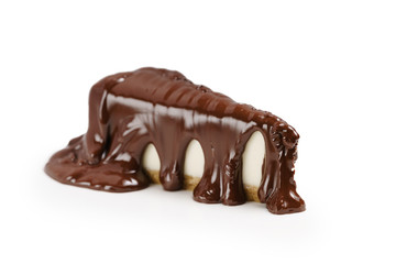 cheesecake covered with thick layer of dark chocolate isolated on white