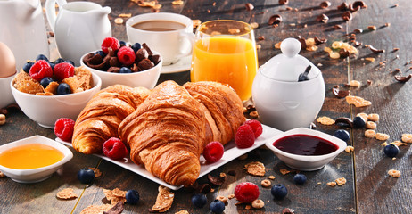 Breakfast served with coffee, juice, croissants and fruits