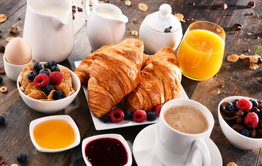 Breakfast served with coffee, juice, croissants and fruits