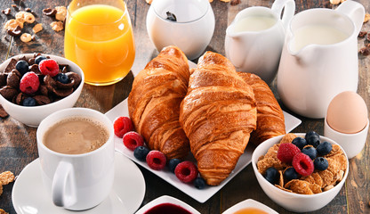 Breakfast served with coffee, juice, croissants and fruits