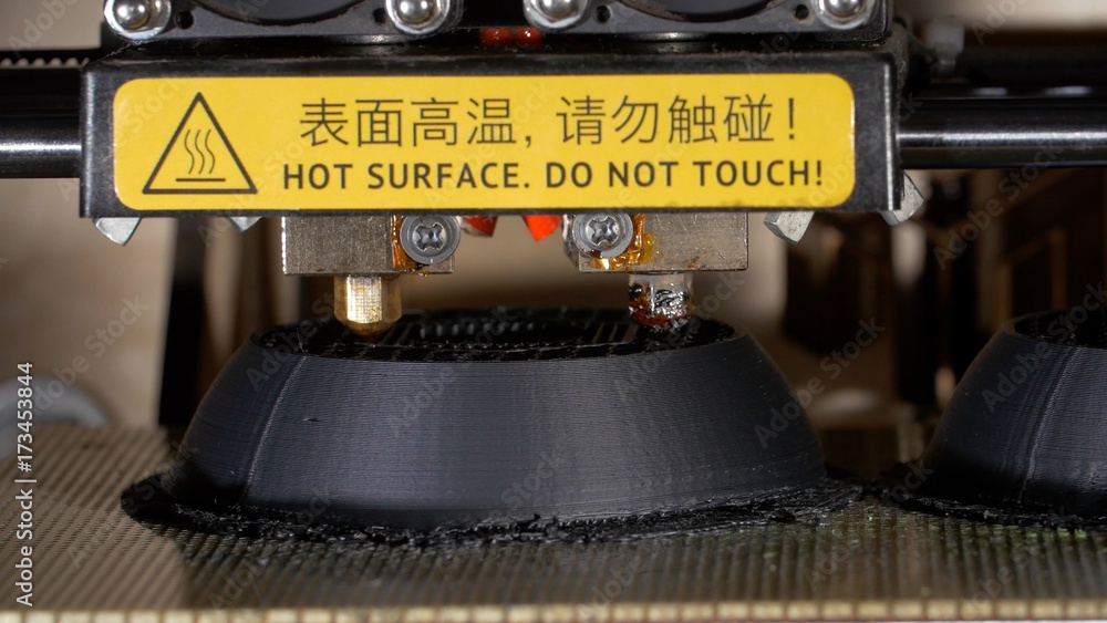 Poster close up of a modern 3d printer. head of 3d printer in action. close up of 3d printer operating in d