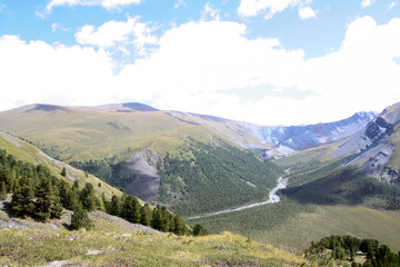 Naklejka premium Russia, Republic of Altai. Very beautiful pictures of nature in Altai High snow-capped mountains, fast, noisy mountain rivers, beautiful meadows and fields and woods - the nature of mountain Altai