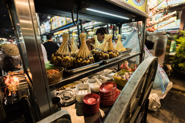 Satay sticks ready to be sold by a street food vendor in Asia