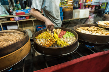 Dim sum being slowly steamed at a market in Asia